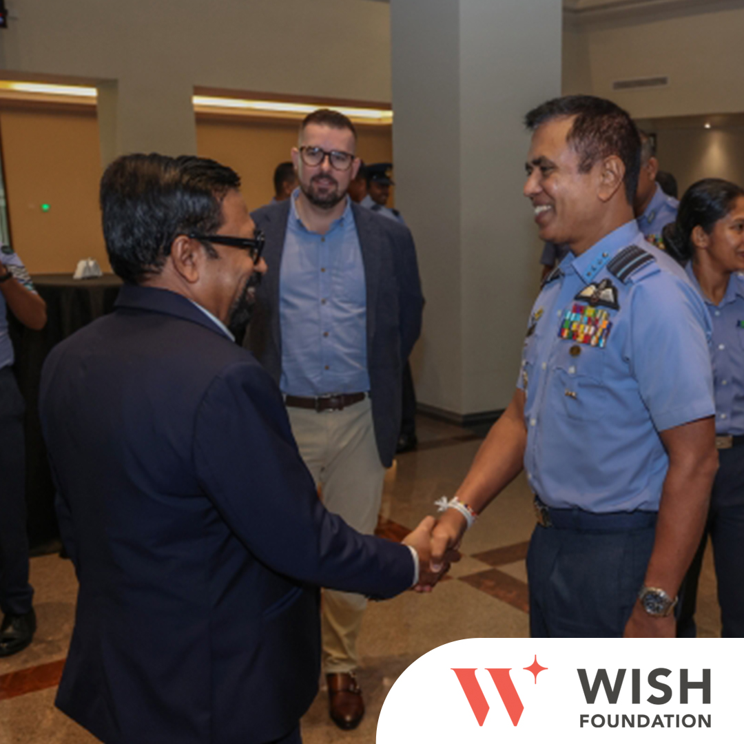 Hearing aid presentation to child of SLAF corporal at SLAF headquarters