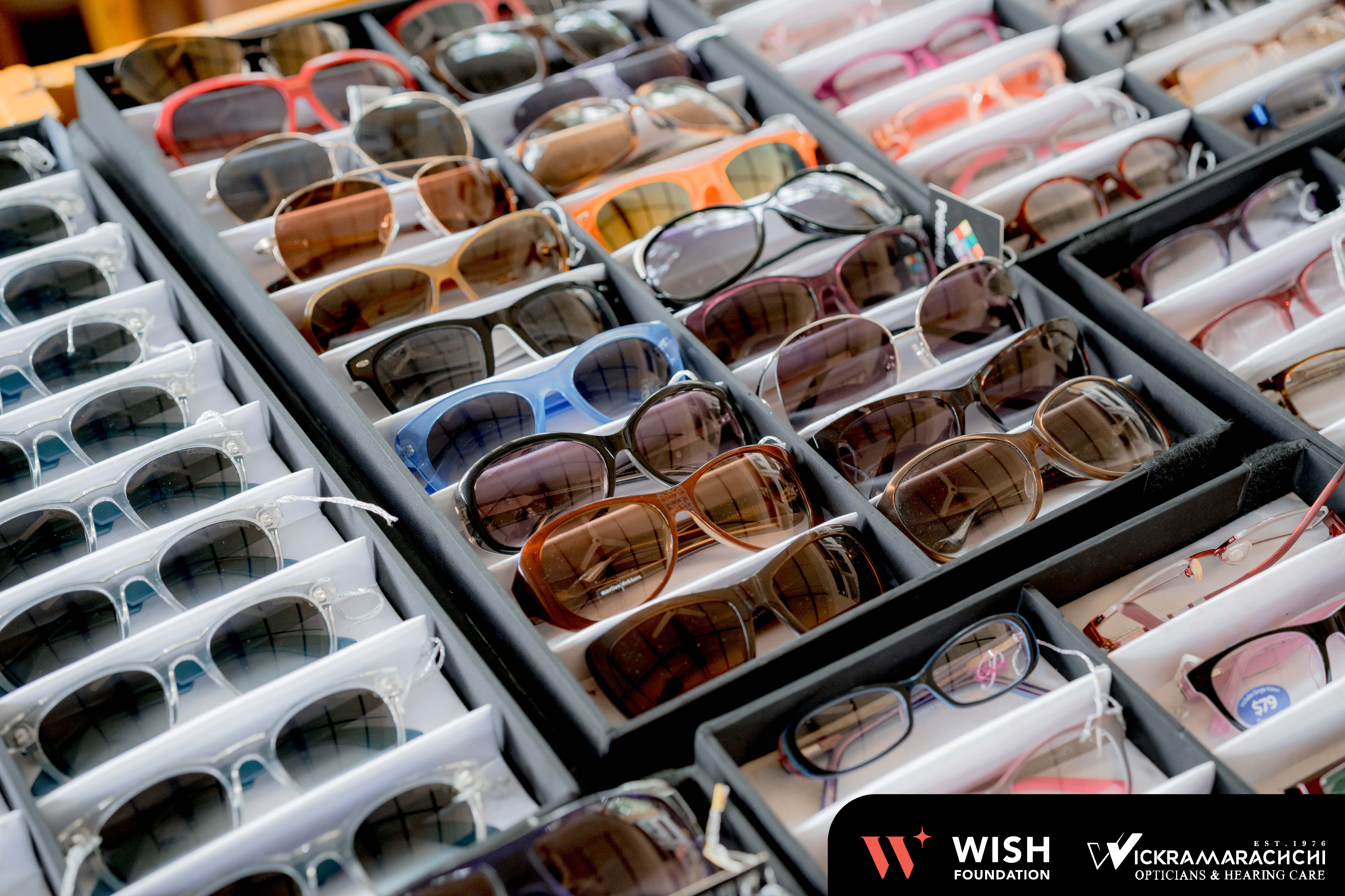 Children receiving UV sunglasses at the camp